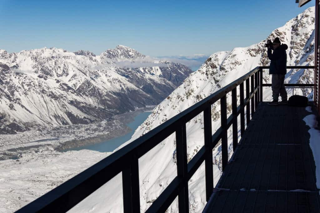Photographer on balcony at Plateau Hut