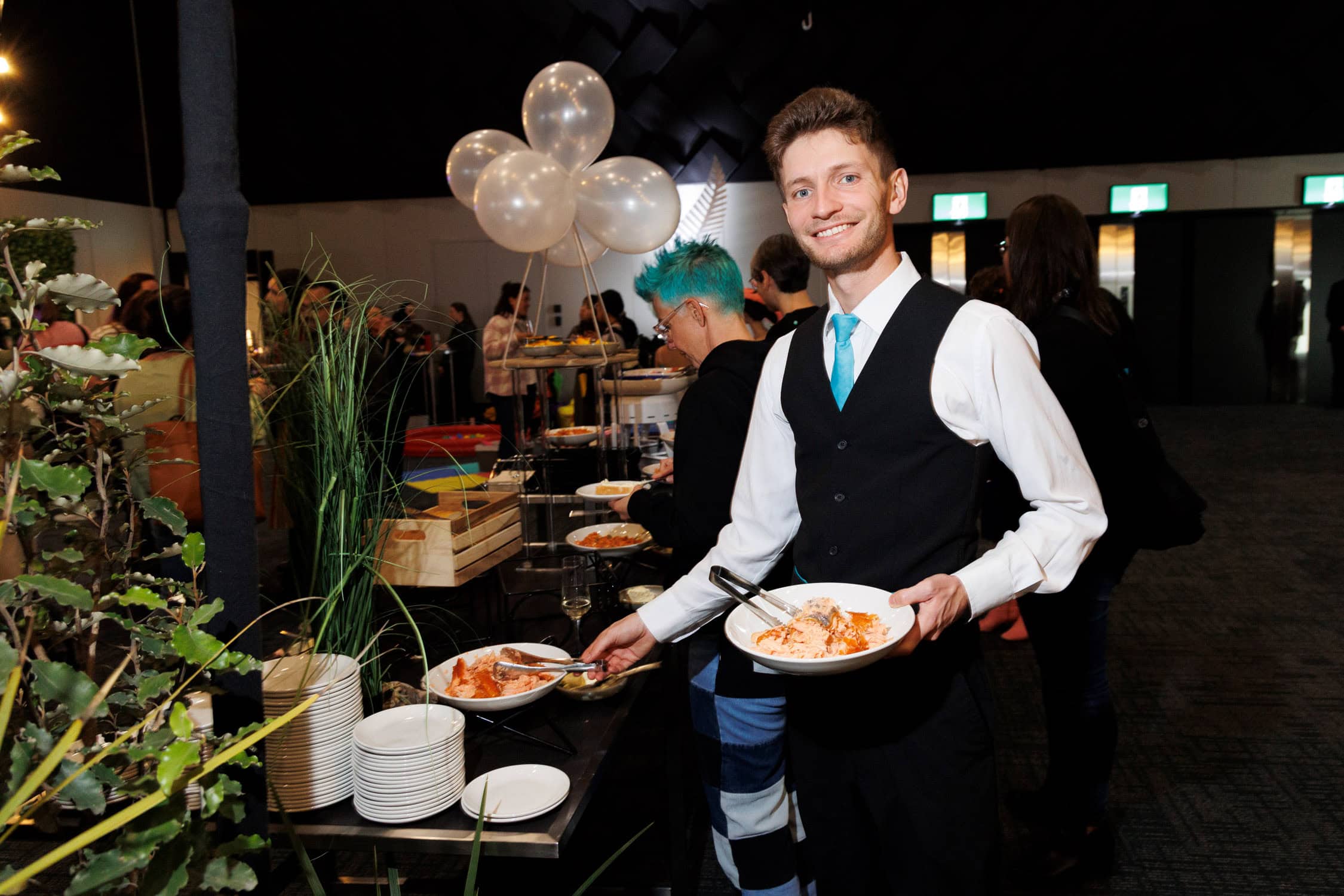 Waiter at Te Pae serves dinner.