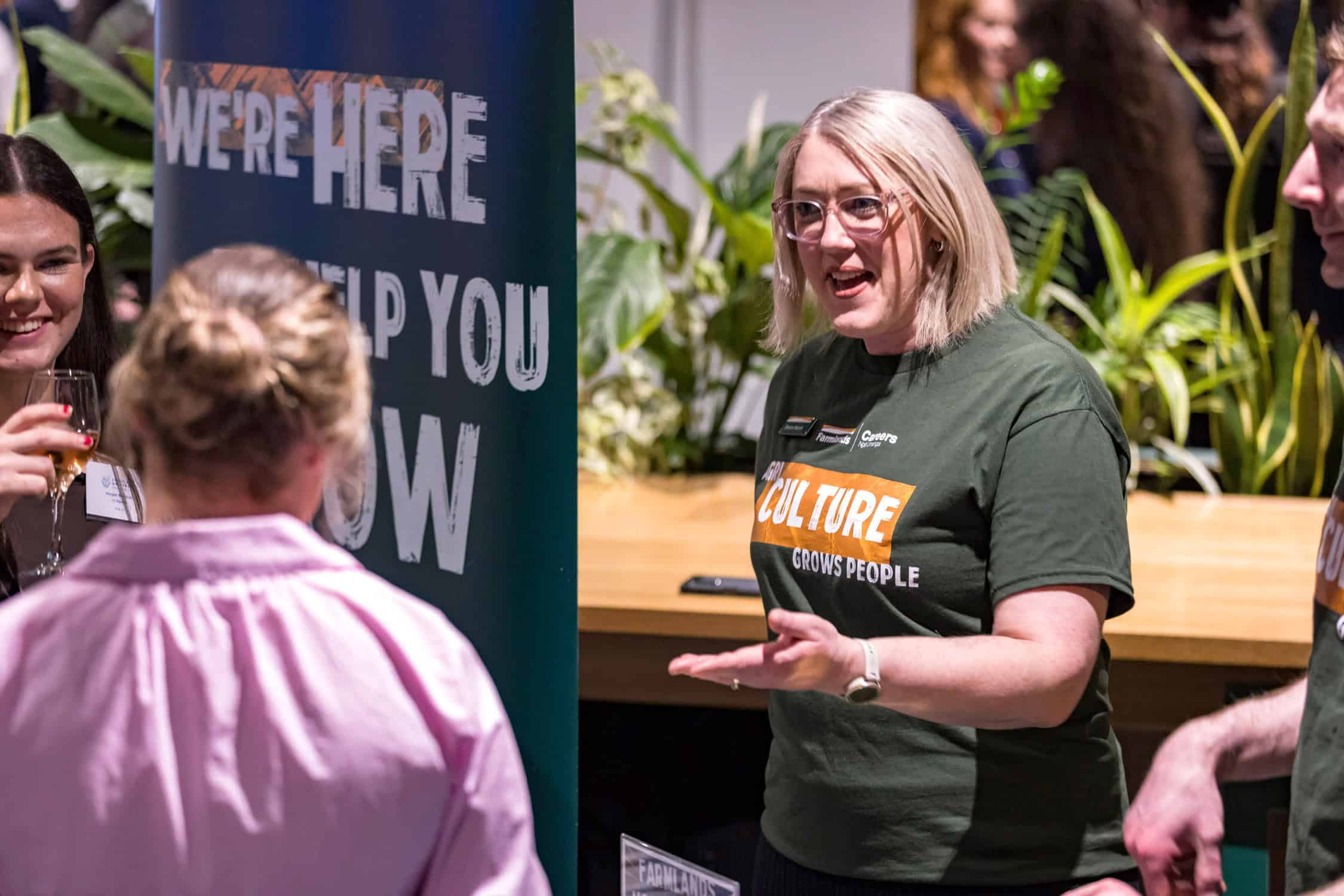 Presenter talks to prospective intern at careers expo.