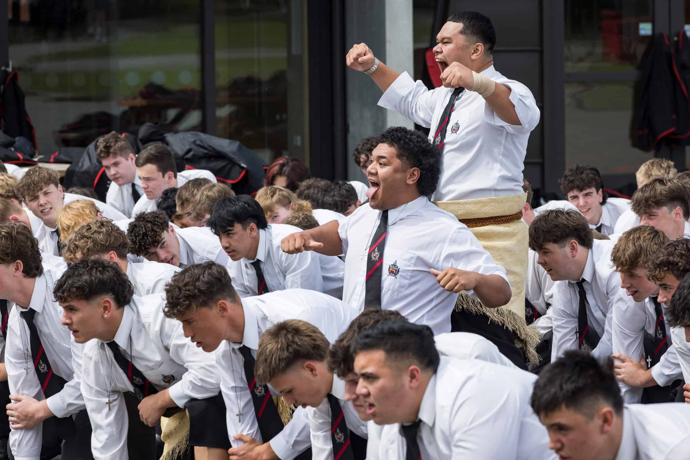 Boys perform a rousing Haka at school event.