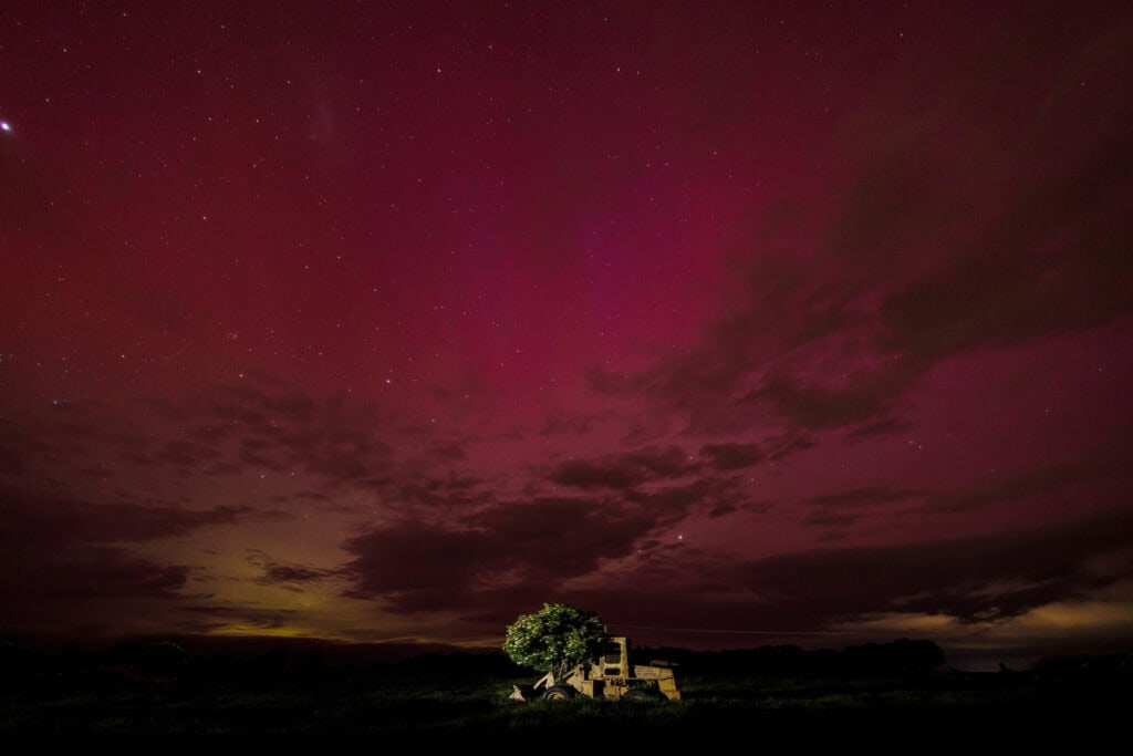 Old dozer in paddock Canterbury with Aurora Australis behind November 2025