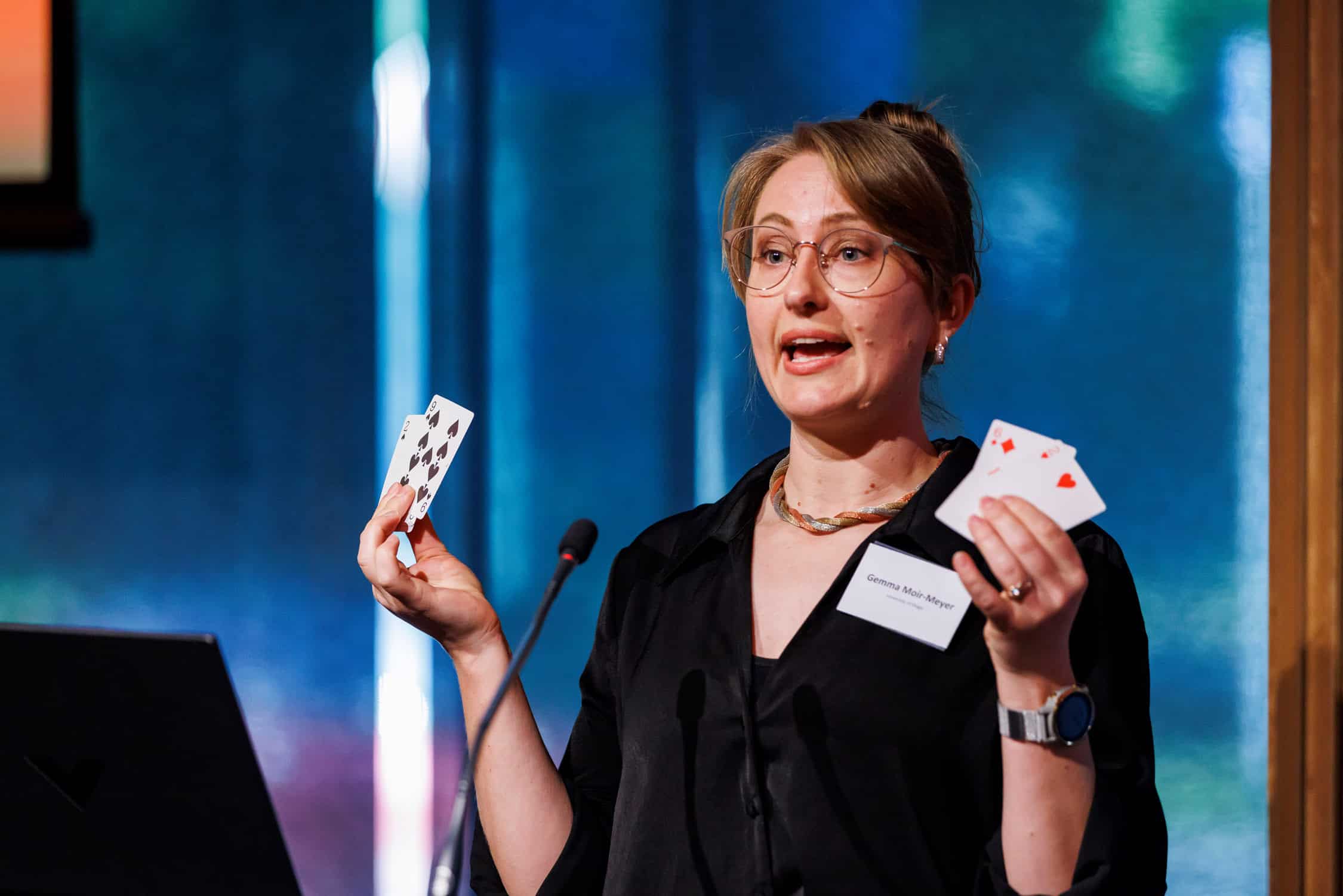 Inspirational speakers uses playing card props in her delivery at Te Conference and Event Centre, Christchurch.