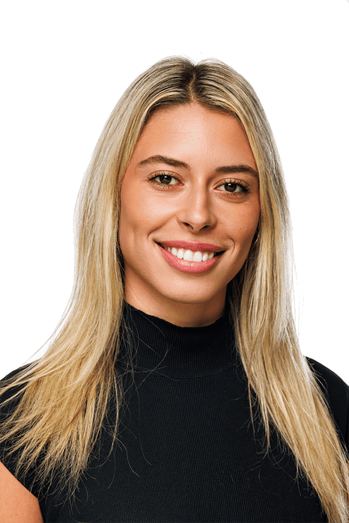 Staff headshot on white of young female administrator.