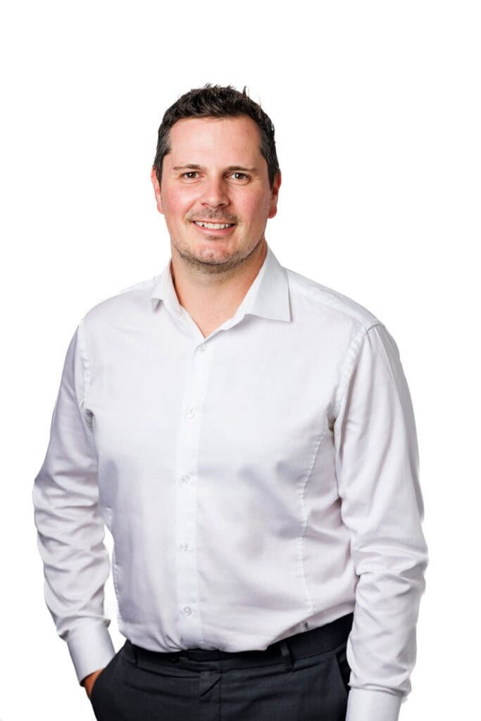 Staff profile 3/4 length of male mortgage broker.